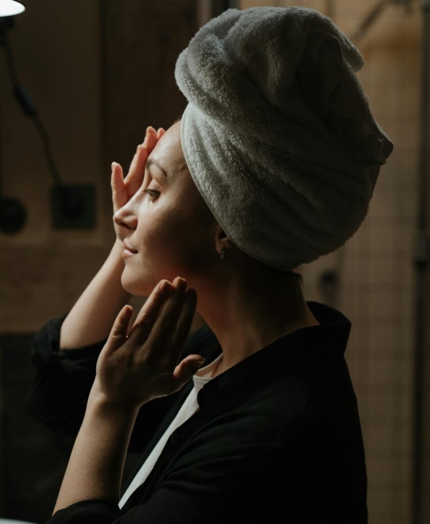 A woman indulges in a soothing skincare routine at home, promoting wellness and tranquility.